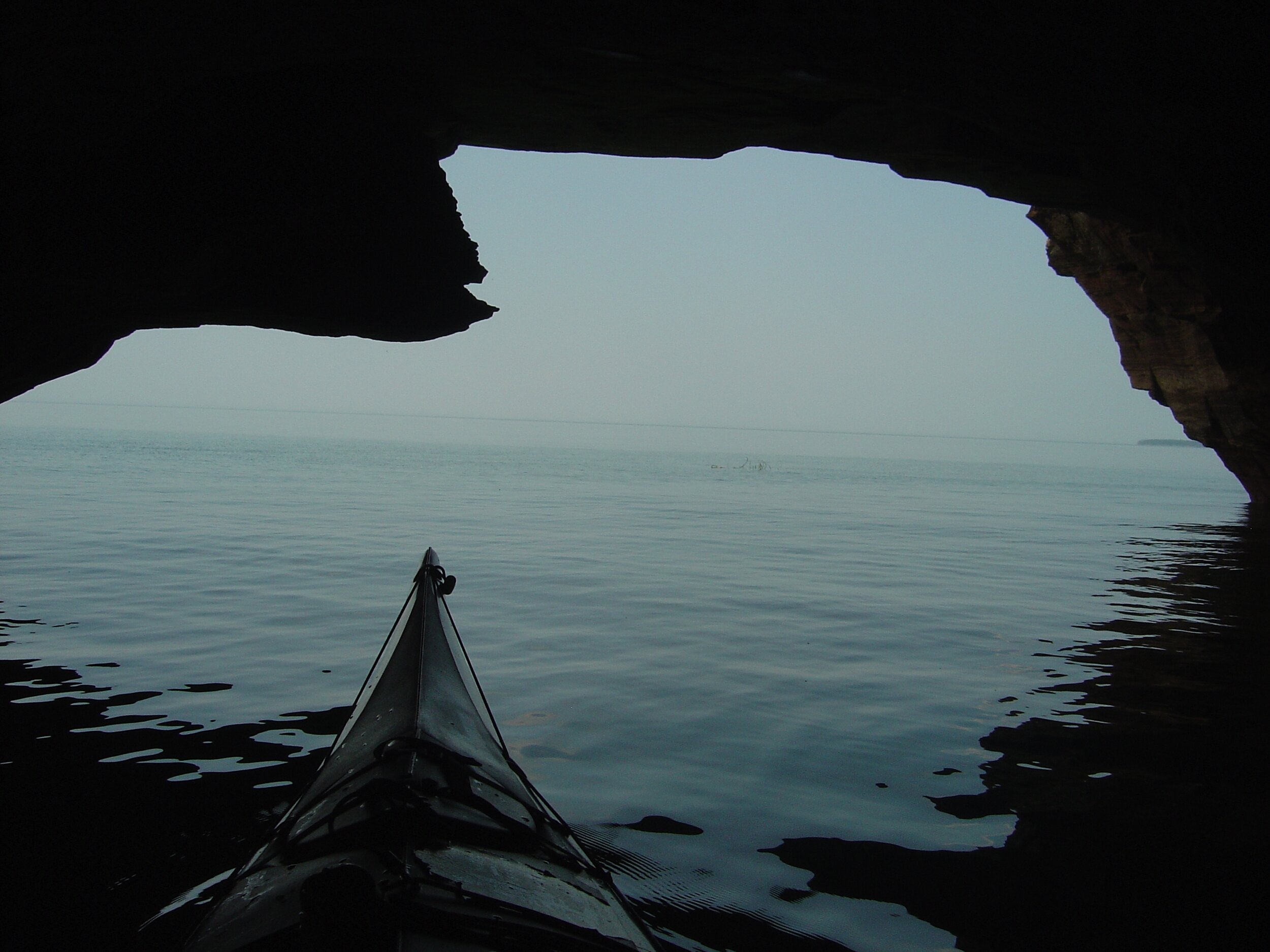 riding out of a sea cave at dawn
